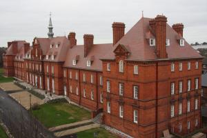 Reroof of Mckee Army Barracks in country brown tiles